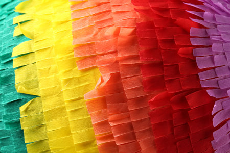 Pinata. Cut tissue paper in different colors as background, closeupの写真素材