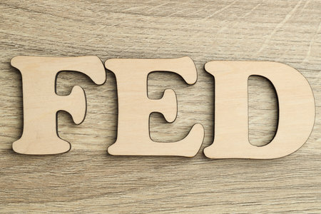 Word Fed (Federal Reserve System) made with letters on wooden table, top viewの写真素材