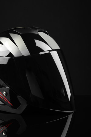 Motorcycle helmet with visor on black backgroundの写真素材
