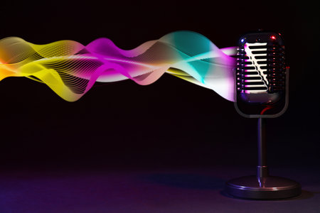 Sound wave and microphone on black backgroundの写真素材