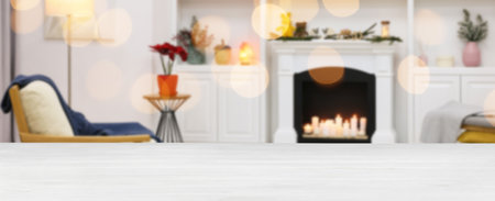 Empty table in room with Christmas lights, bokeh effect. Banner designの写真素材