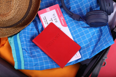 Different clothes, passport and ticket as background, closeup. Travel luggageの写真素材