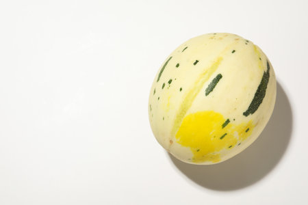 Fresh ripe melon on white background, top view. Space for textの写真素材