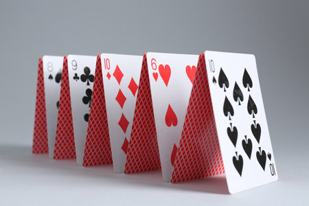 Row of playing cards on gray background, closeupの写真素材