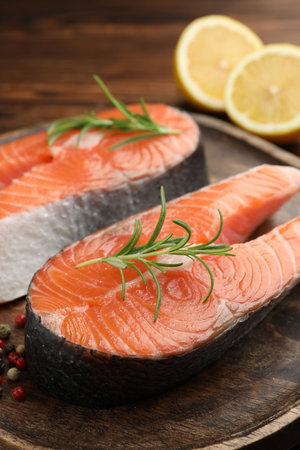 Fresh raw salmon steaks and spices on table, closeupの写真素材