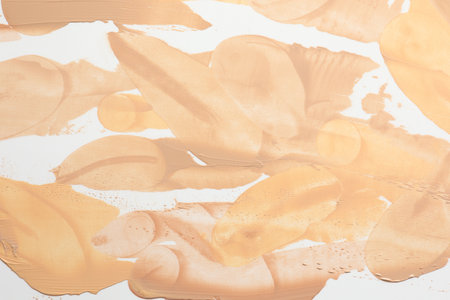 Smudged foundations on white background, top viewの写真素材