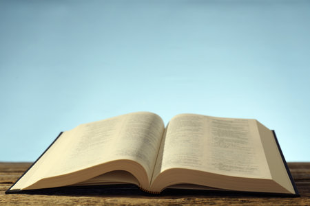 Open Holy Bible in English language on wooden table. Space for textの写真素材