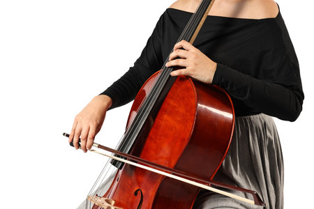 Young woman playing cello on white background, closeupの写真素材