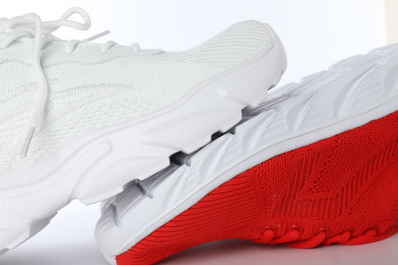 Colorful sneakers on white background, closeup. Stylish sportswear