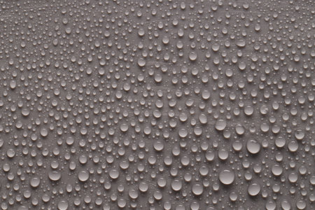 Water drops on gray background, top viewの写真素材