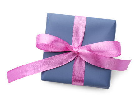 Beautiful gift box with pink bow isolated on white, top viewの写真素材