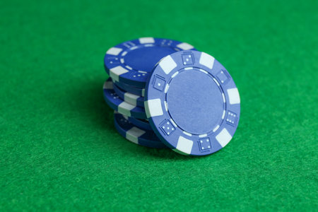 Group of poker chips on green table, closeupの写真素材