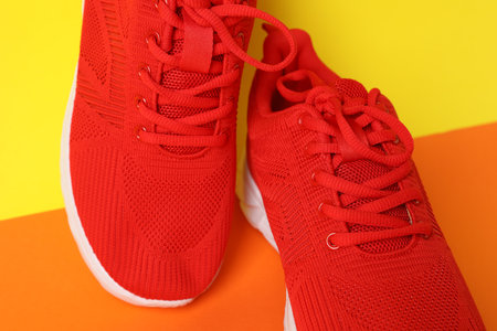 Pair of stylish sneakers on color background, closeupの写真素材