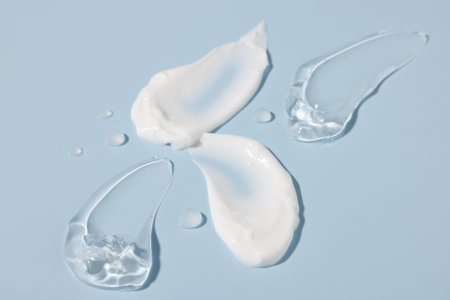 Samples of cosmetic products on light blue background, closeupの写真素材