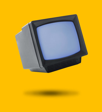 Retro TV set in air on orange backgroundの写真素材