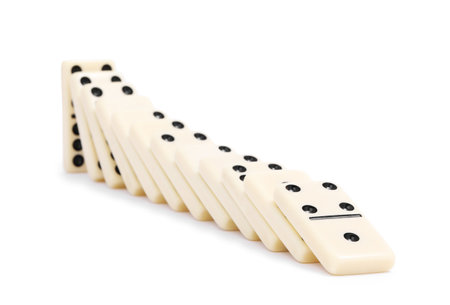 Domino effect. Tiles falling on white backgroundの写真素材