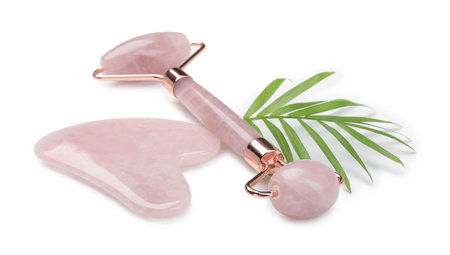 Face roller and gua sha tool isolated on whiteの写真素材