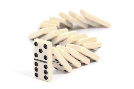 Domino effect. Tiles falling on white backgroundの写真素材