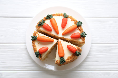 Delicious carrot cake on white wooden table, top viewの写真素材