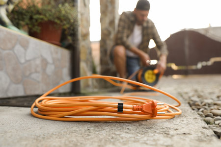 Extension cord reel outdoors, selective focusの写真素材