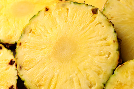 Pieces of juicy pineapple as background, closeup
