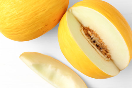Fresh ripe melons on white table, top viewの写真素材
