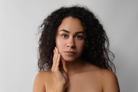Beautiful woman with perfect skin on white backgroundの写真素材