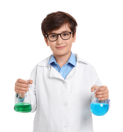 Young person in a lab coat holding chemistry glassware with colored liquids against white background, imagining a future in scienceの写真素材