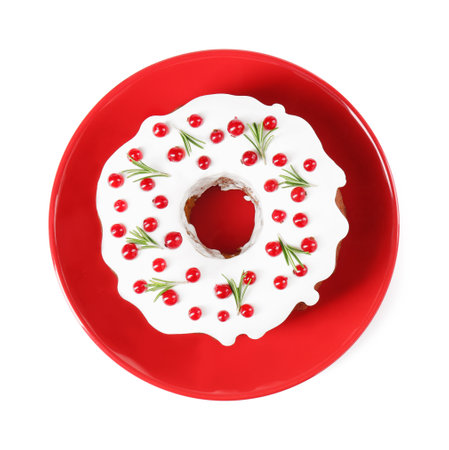 Traditional Christmas cake decorated with currants and rosemary isolated on white, top viewの写真素材