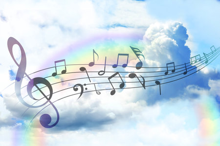 Musical symbols in beautiful sky with clouds and rainbowの写真素材