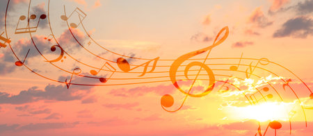 Musical symbols in beautiful sunset sky with clouds, banner designの写真素材