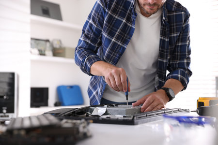 Computer repair work at white table, closeupの写真素材