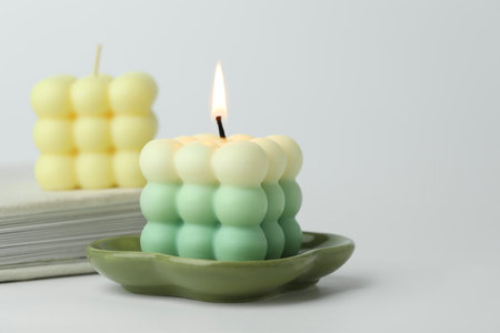 Beautiful bubble candles on light background, closeupの写真素材