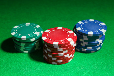 Stacks of poker chips on green table, closeupの写真素材