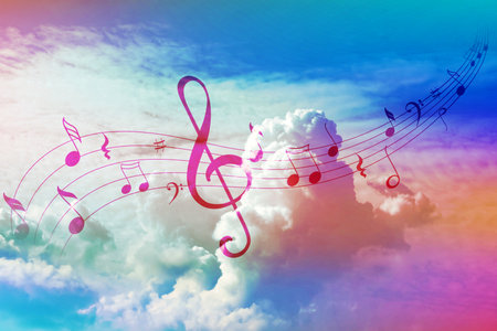 Musical symbols in beautiful sky with clouds, color tonedの写真素材