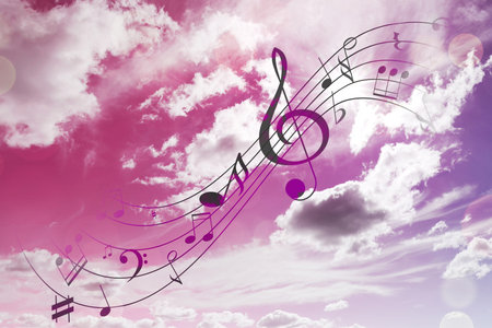 Musical symbols in beautiful sky with clouds, color tonedの写真素材