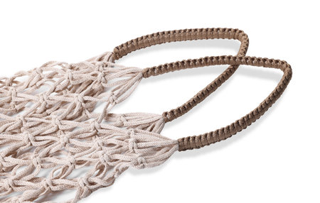 Handmade macrame shopping bag isolated on white