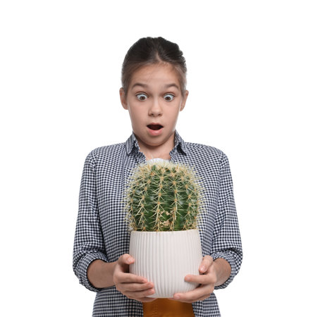 Emotional girl with potted cactus pretending to be gardener on white background. Dreaming of future professionの写真素材