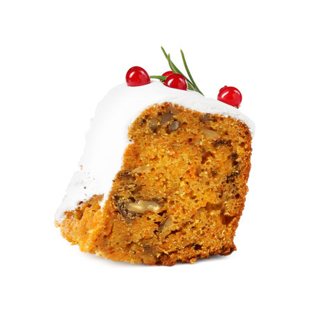 Piece of traditional Christmas cake decorated with red currants and rosemary isolated on whiteの写真素材