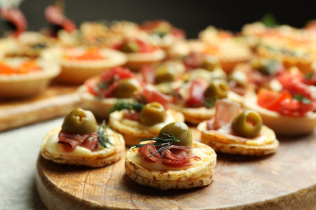 Many different tasty canapes on white table, closeupの写真素材