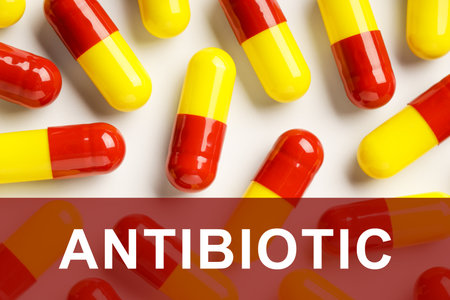 Word Antibiotic and pills on white background, top viewの写真素材