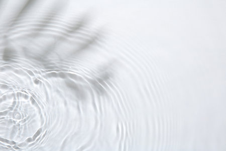 Rippled surface of clear water on white background, top viewの写真素材