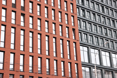 Exterior of modern building with many windows in city, low angle viewの写真素材