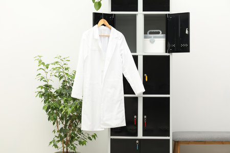 Medical personnel uniform on locker in changing roomの写真素材