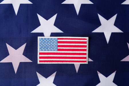 Veterans day. American army patch on USA flag, top viewの写真素材