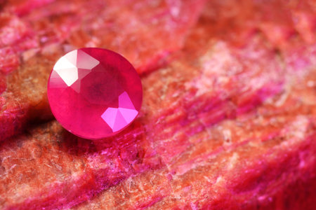 Beautiful shiny pink gemstone on natural mineral, closeupの写真素材