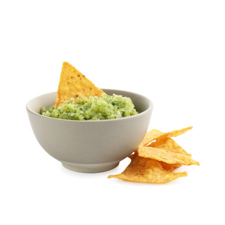 Delicious homemade green salsa with nachos isolated on whiteの写真素材