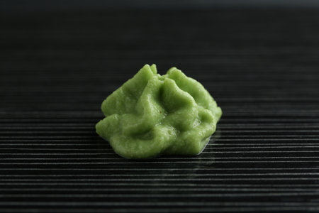 Hot wasabi paste on black textured table, closeupの写真素材