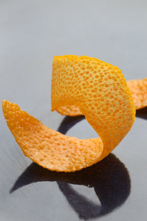 Fresh orange peel on dark table, closeupの写真素材