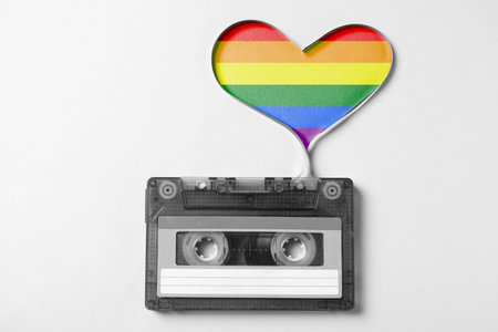 Music cassette and heart made with tape on white background, top view.の写真素材